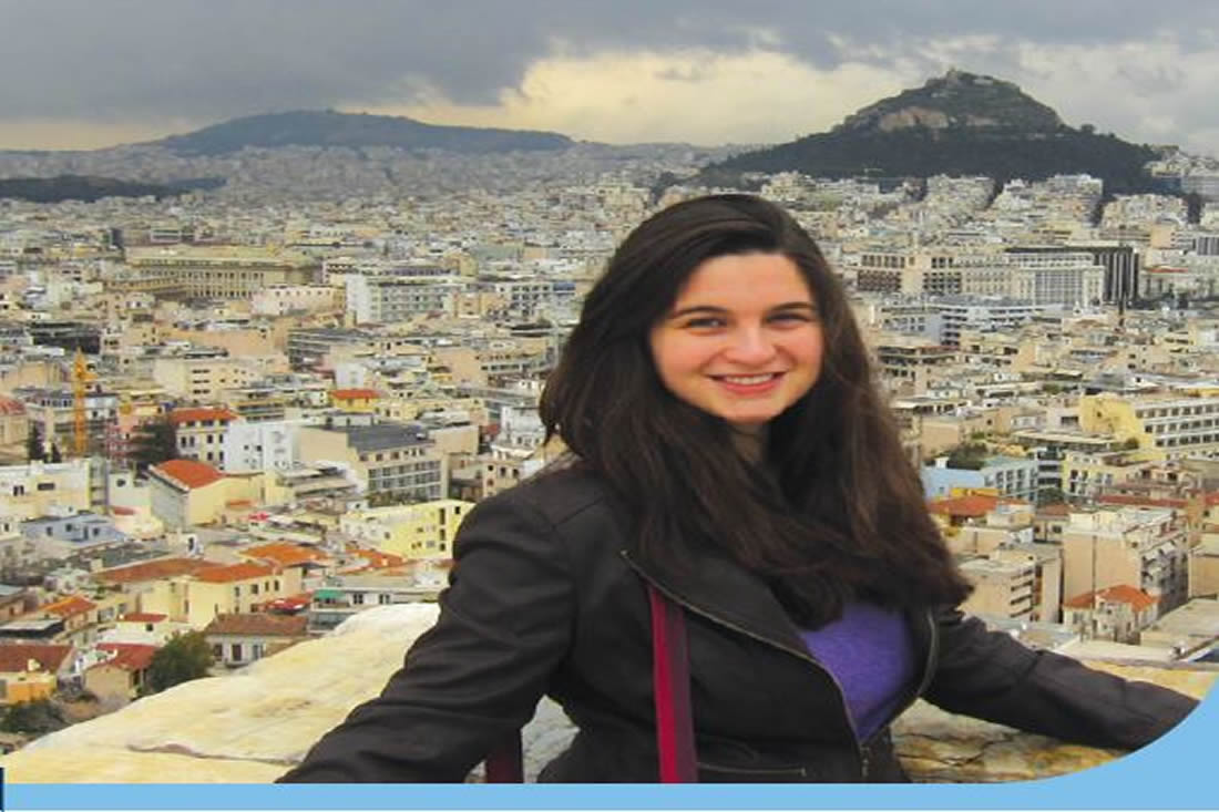 This is a student standing infront of a city scape in Europe